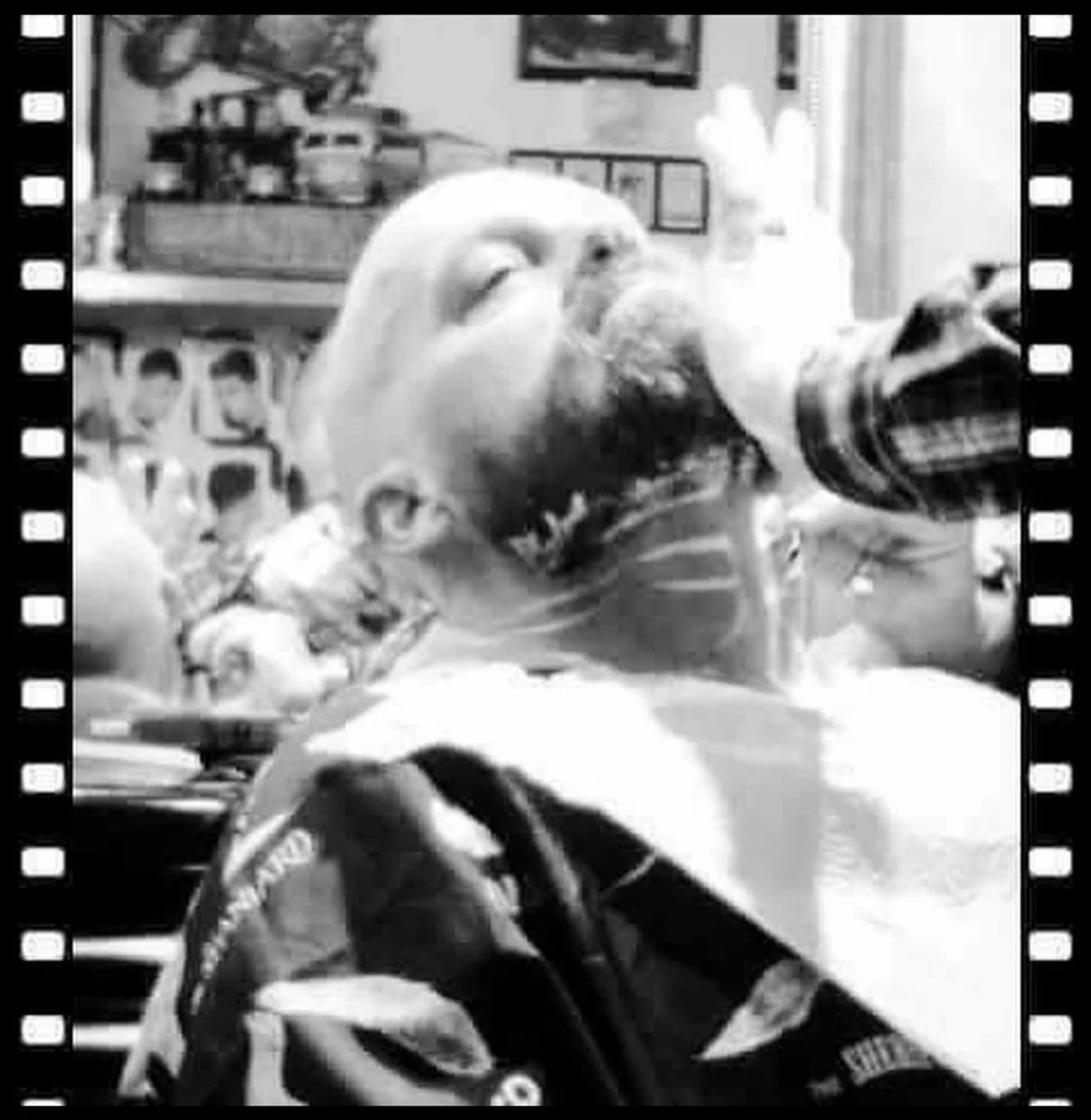A shave in progress, framed like a strip of film, in black and white.